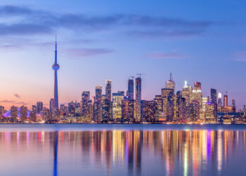 Skyline of Toronto against a backdrop of purple sky