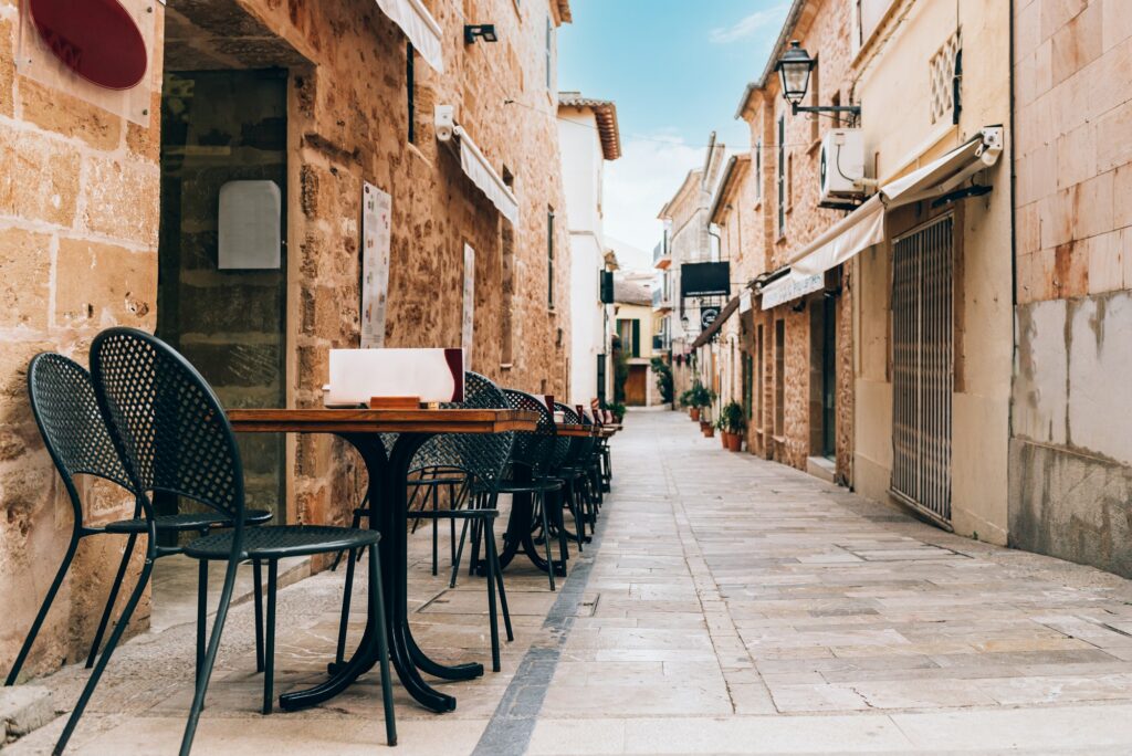 Empty tables of street cafe, Spain