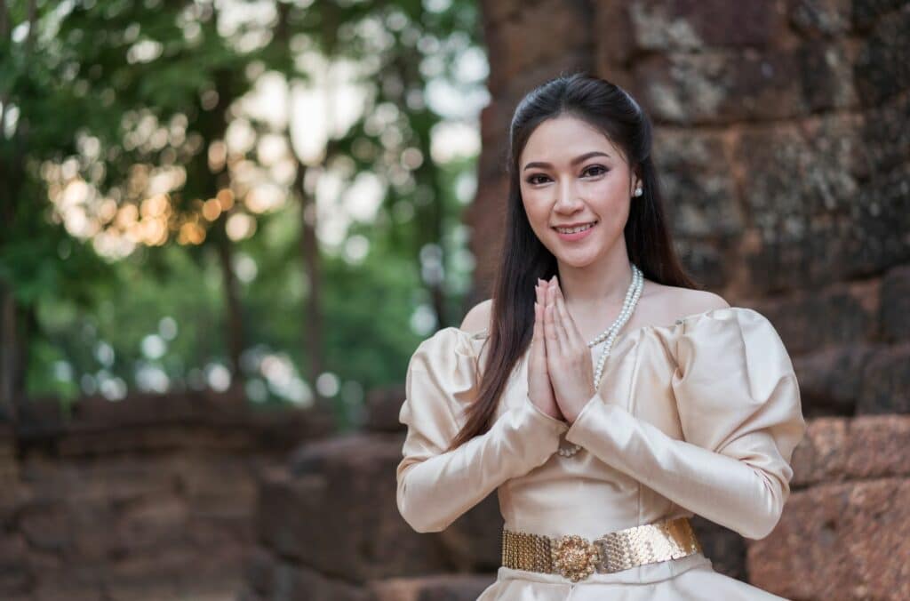 Travel Tips in Thailand: Thai Woman In Traditional Dress Paying Respect