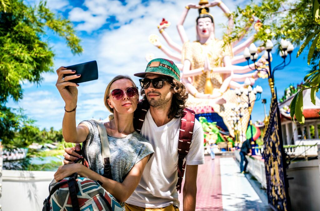 Travel Tips in Thailand Male And Female Tourists Taking Selfies