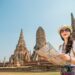 Woman Tourist Holding The Map: Travel Tips in Thailand Ayutthaya