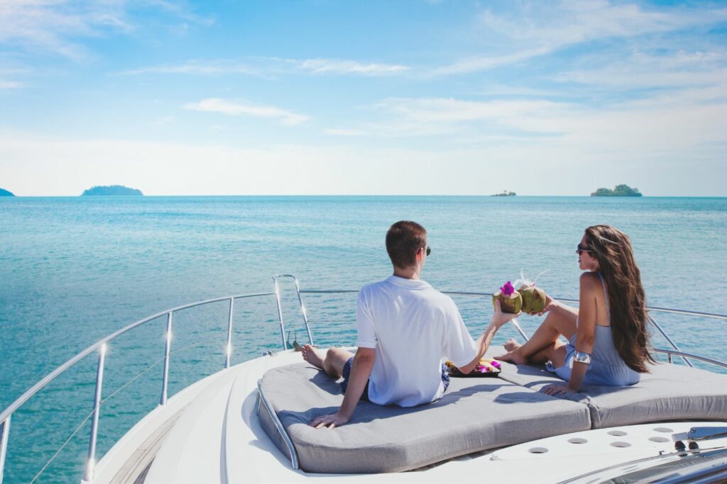Couple enjoying ocean view on yacht deck