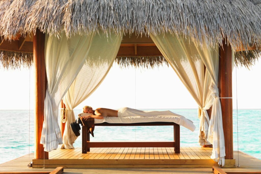 Woman relaxing at oceanfront spa resort
