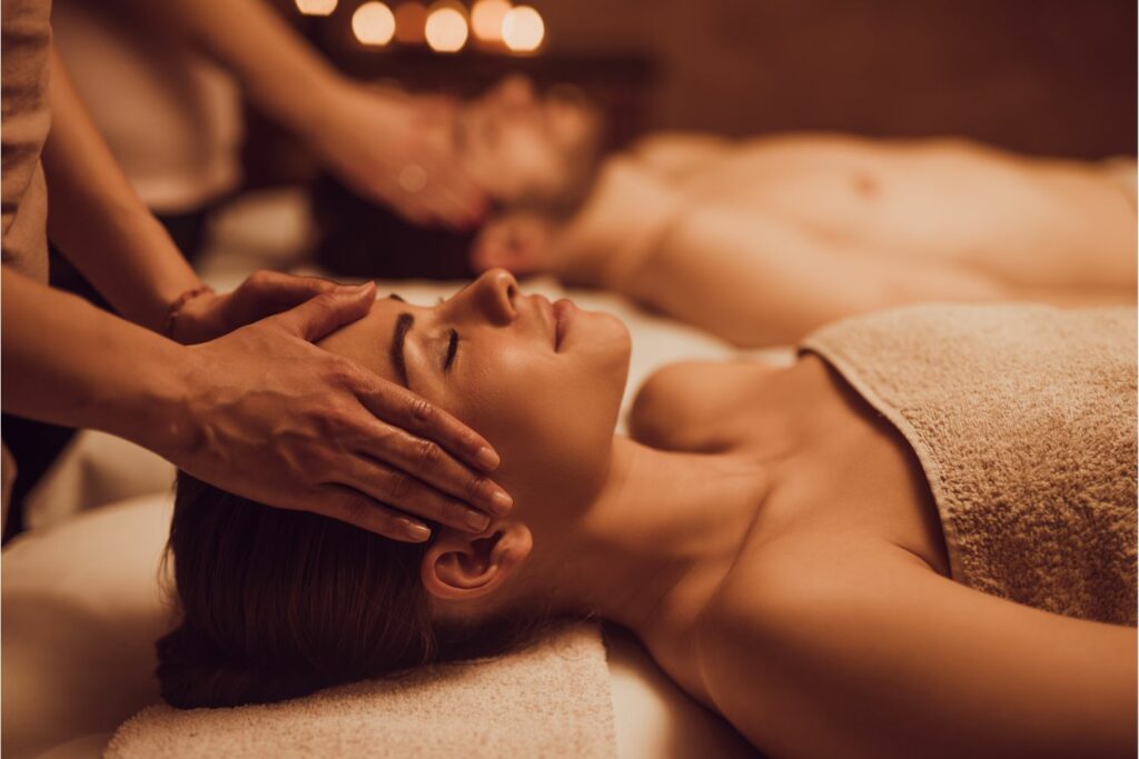 Couple enjoying spa massage at luxury resort