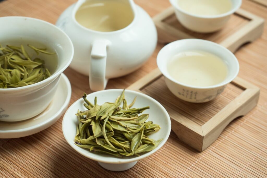 Chinese green tea brewing in a tea set