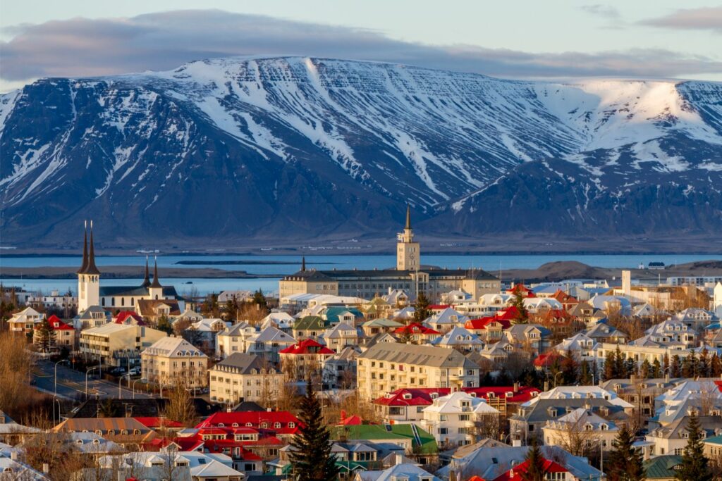 Reykjavik's Colorful Buildings Set Against a Stunning Mountain Landscape