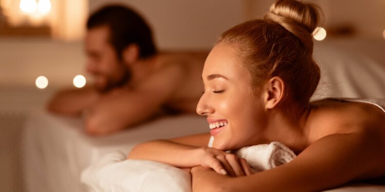 Couple enjoying massage at a luxury spa getaway