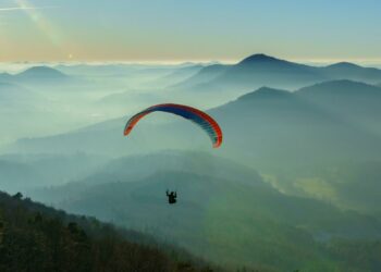 Paraglider Soaring On Top Of The Mountains: Best Locations for Paragliding (Source: Canva)