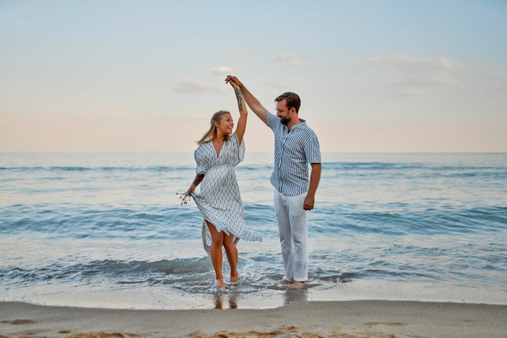 Couple Dancing On The Beach (Source: Canva)