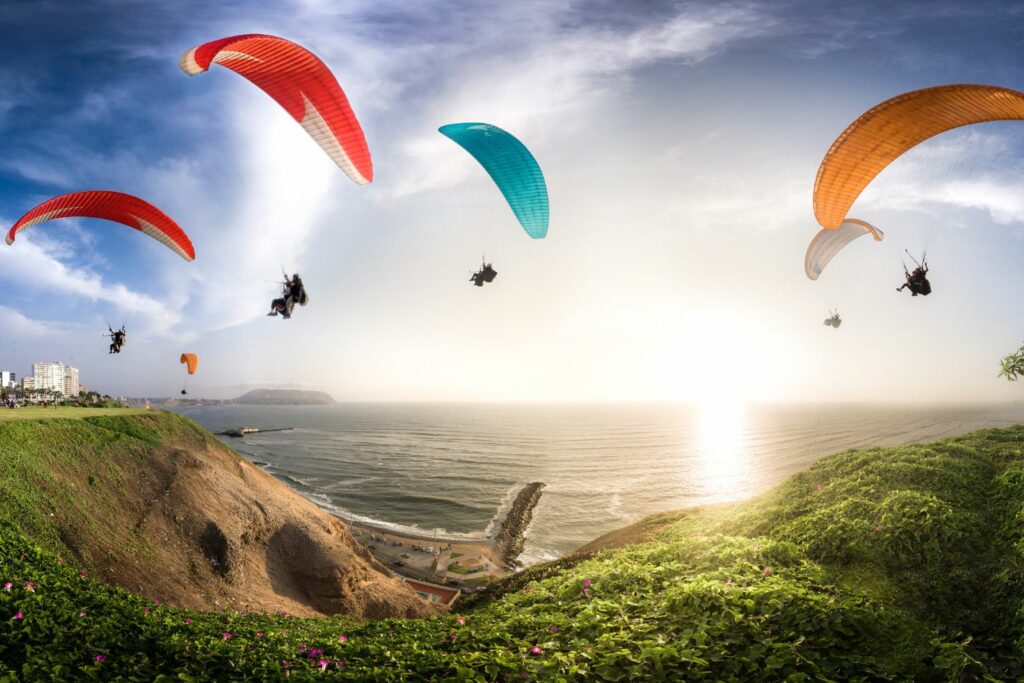 Best Locations for Paragliding: Group of Paragliders on Top of the Cliff (Source: Canva) 
