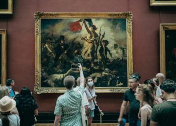 People In Museums and Galleries Appreciating some Paintings (Source: Canva)