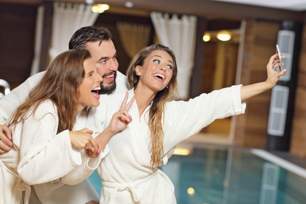 Luxury Spa Getaways for Groups: Friends at a Pool Spa (Source: Canva)