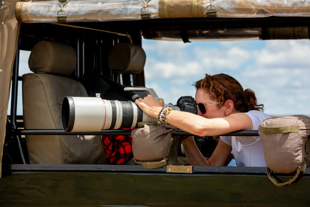 Professional Female Photographer On Safari (Source: Canva)