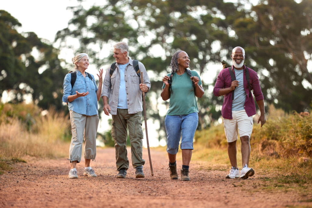 senior friends embracing the physical and mental benefits of hiking