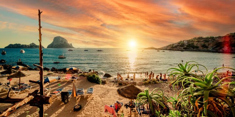 People hangout in one of the best beach party destinations: Ibiza