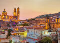 the best vacation spots in mexico panorama of Taxco city at sunset