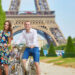 cycling couple near eiffel tower, paris, getting around france