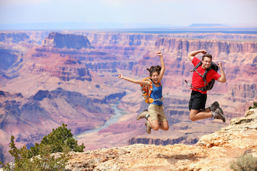 multiethnic couple enjoying hiking benefits in grand canyon