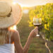 woman enjoying wine in vineyard, hunter valley wineries, sunny day