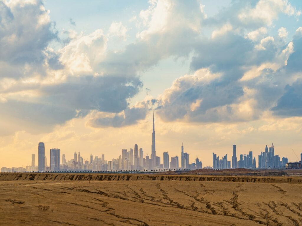 Dubai Downtown skyline with desert san - best deserts in dubai