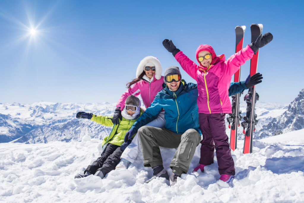 Happy family enjoying winter vacation at a luxury ski resort