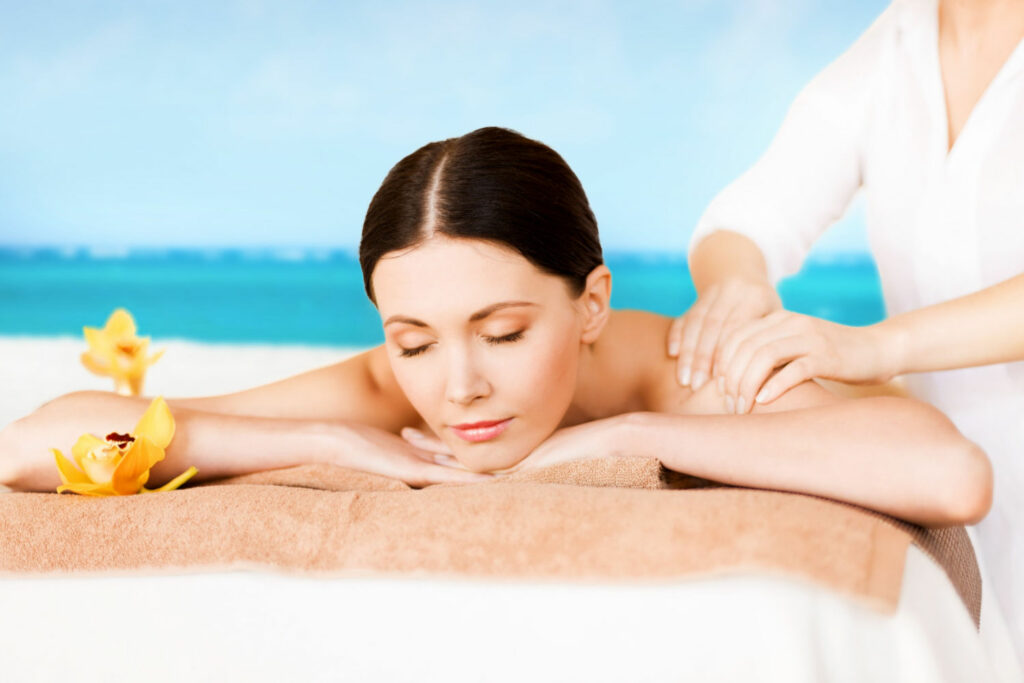 woman receiving beachside massage at australia's best retreats