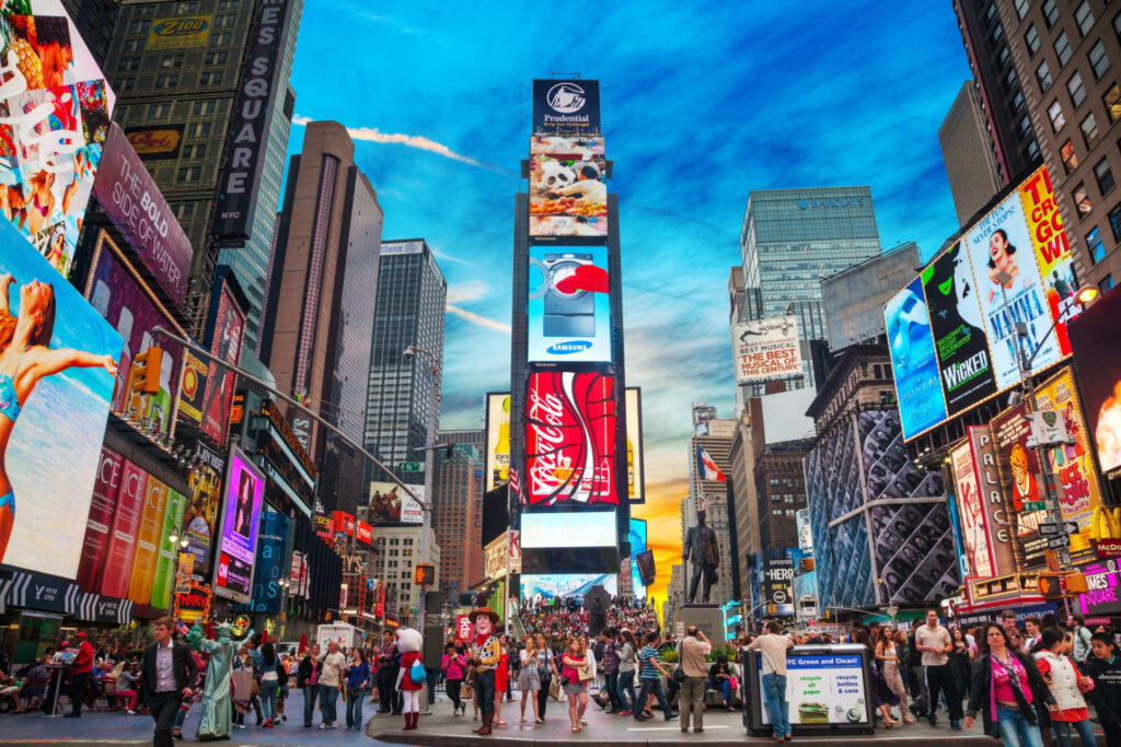 vibrant times square filled with visitors, top things to do in new york