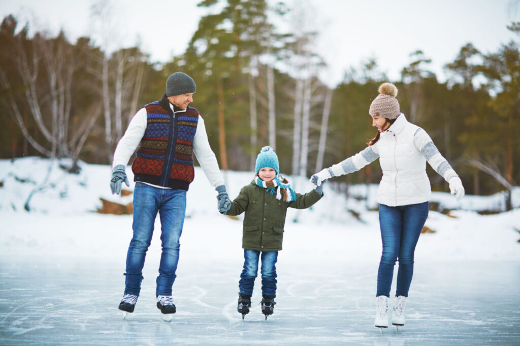 Family on ice rink at the ski resort