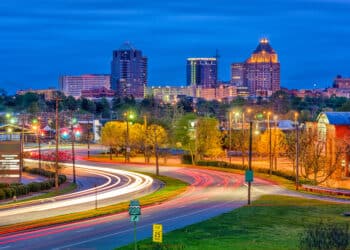 Greensboro, North Carolina, USA downtown skyline and highways.