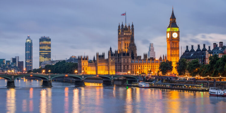 View of the Big Ben and Westminster Bridge at dusk, London, UK