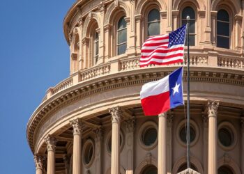 American and Texas State Flag on the Dome of Texas State Capitol
