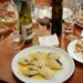 Ravioli with Glass of White Wine, a food from Northern Italy