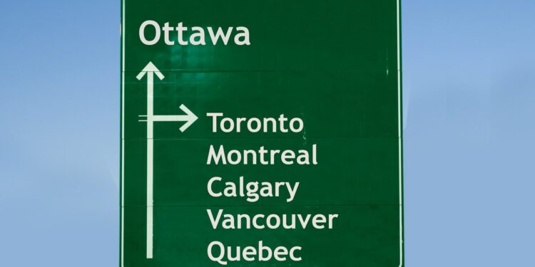 Road sign to Toronto, Montreal, and other cities in Canada