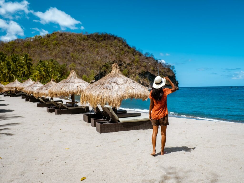 Woman With Summer Hat Walking on the Beach of Anse Chastanet, St. Lucia