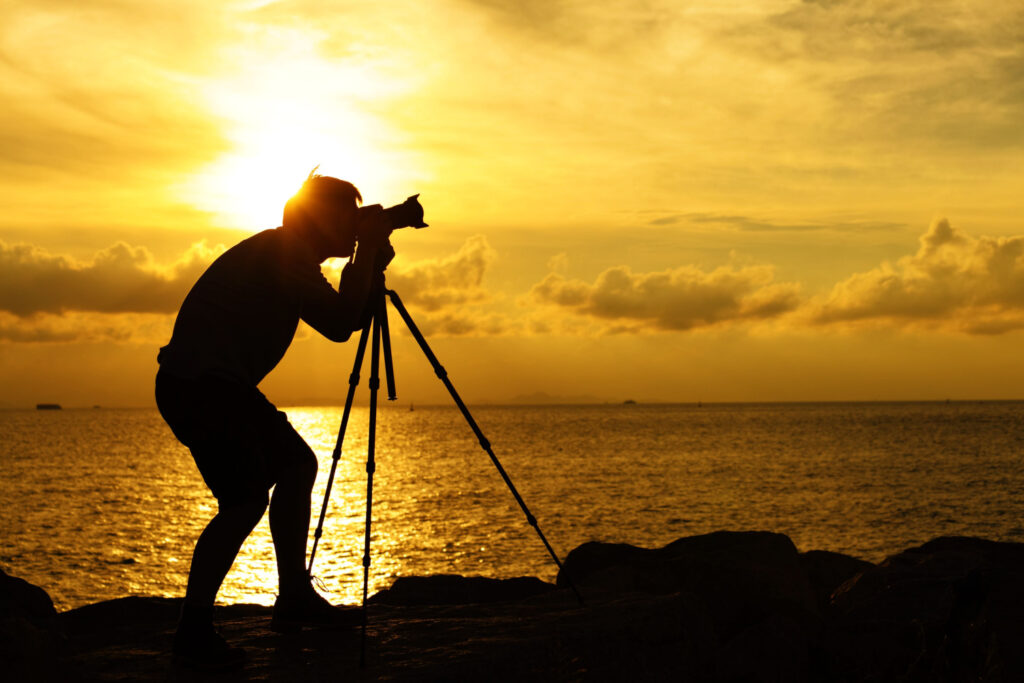 Silhouette of a photographer at sunset