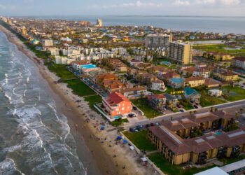 aerial drone view above south padre island beach, one of the islands in texas