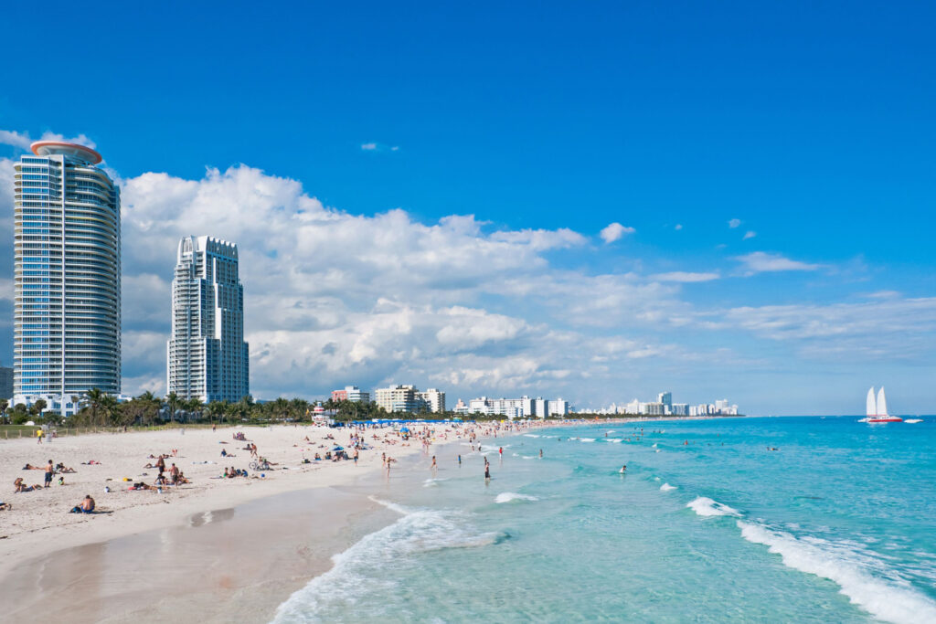 People swimming and sunbathing at Miami Beach, Florida