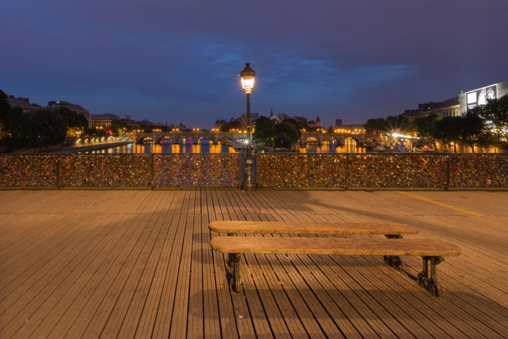 Love padlocks on Pont des Arts bridge, Paris by night