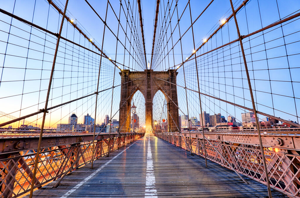 New York, Brooklyn bridge at night, USA - TTstudio/Shutterstock