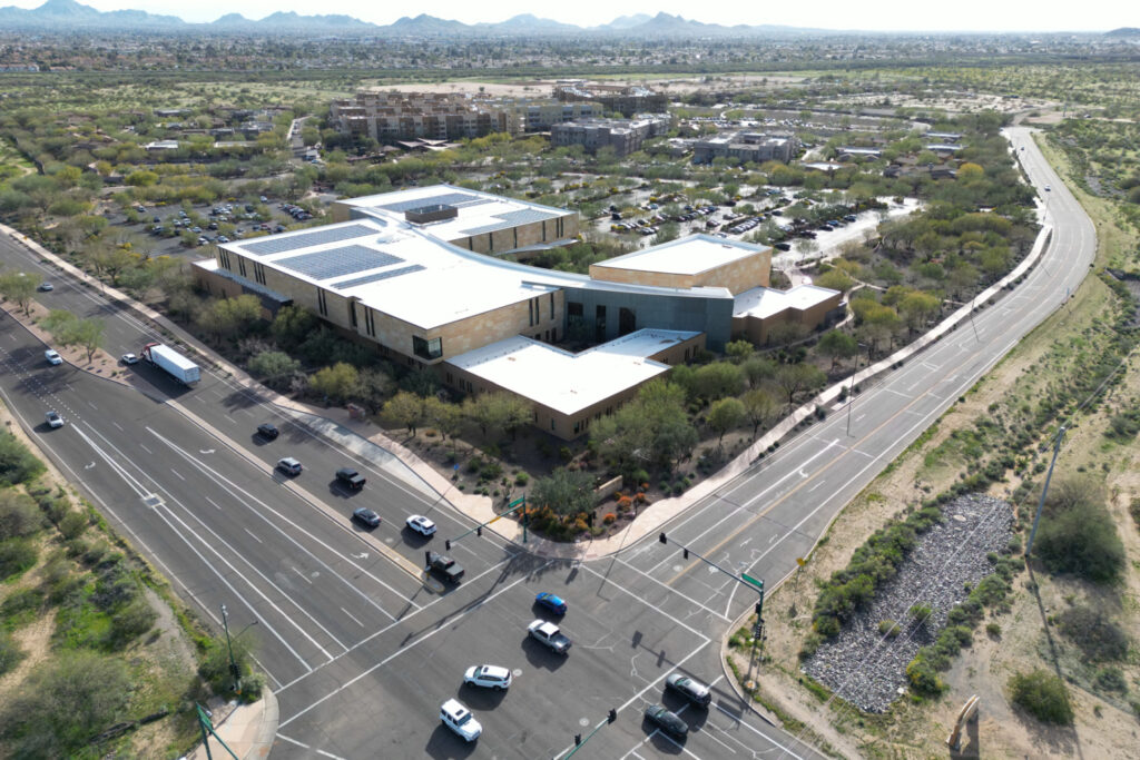 Aerial view of the Musical Instrument Museum, set against the striking desert landscape