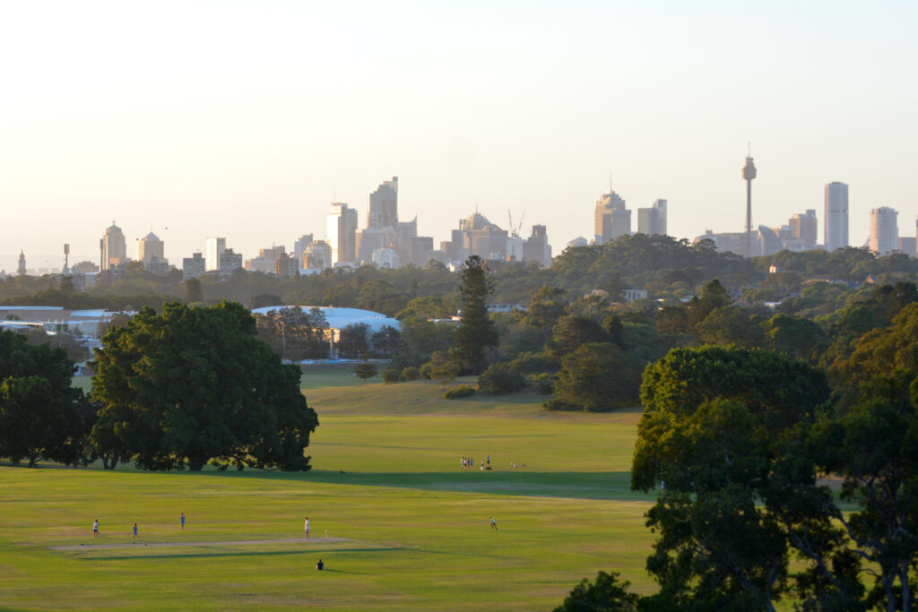 Sydney city skyline at sunset as view from Centennial Park in New South Wales, Australia.  ChameleonsEye/Shutterstock