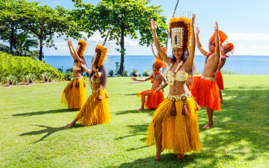 Polynesian women perform traditional dance in Tahiti Papeete.  sarayuth3390/Shutterstock